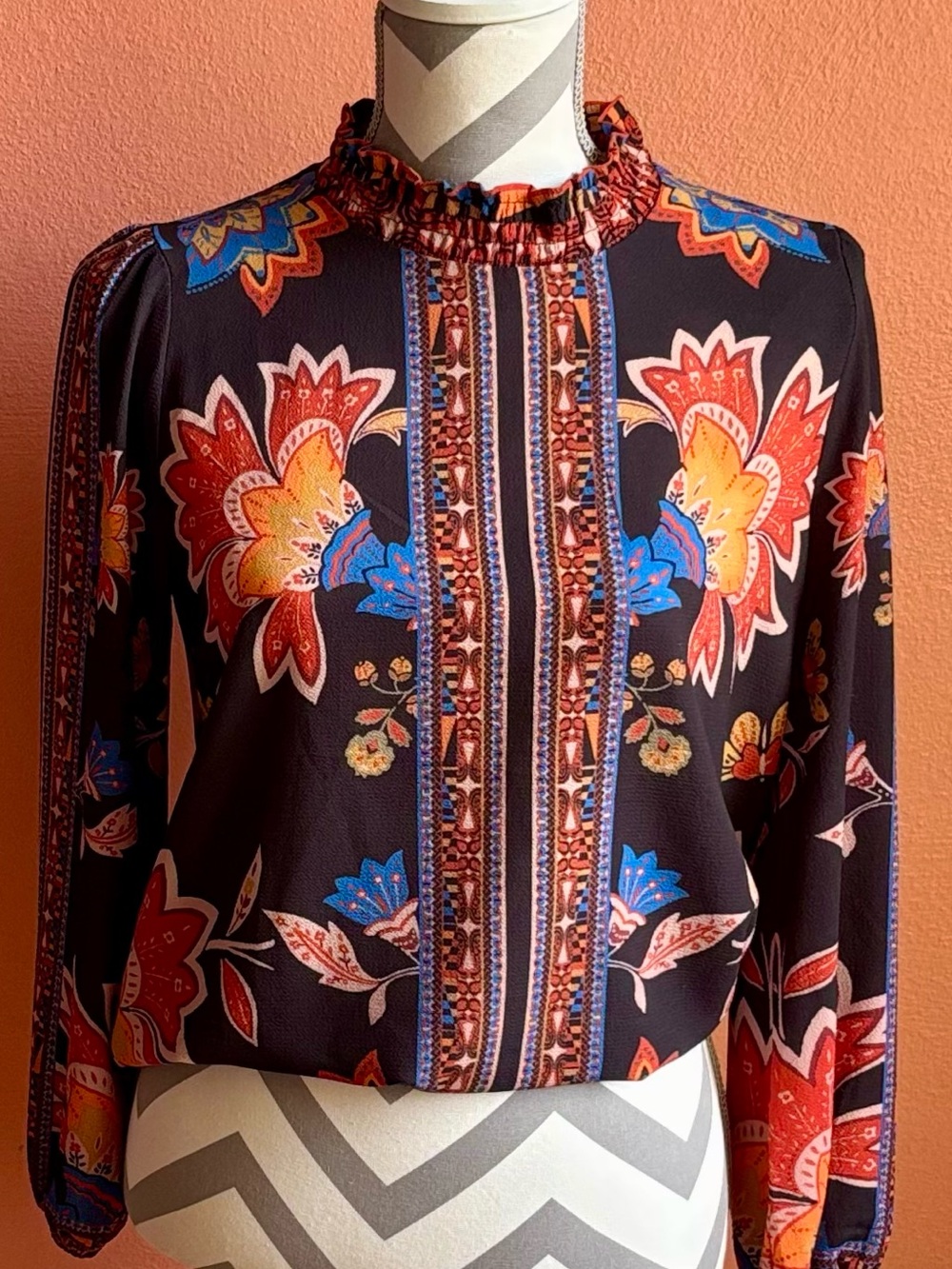 Black Floral Mock-Neck Blouse with Red, Orange & Blue Accents